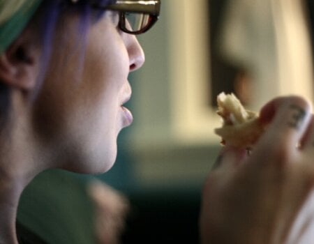 Woman eating pastry