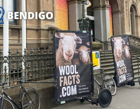 two bicycle billboards with "WoolFacts.com"