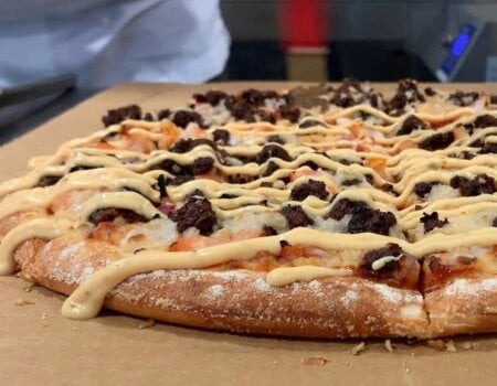 Photo of vegan beef on a Domino's pizza.