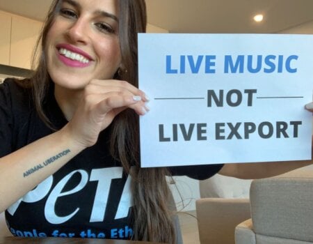 PETA staff with a sign which reads Live Music Not Live Exports