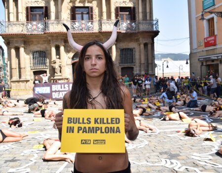 Fifty-four protesters staged a “crime scene” cordoned off with yellow tape in Pamplona, Spain.