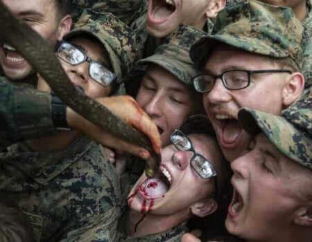 Marines drink blood from a snake at Cobra Gold.