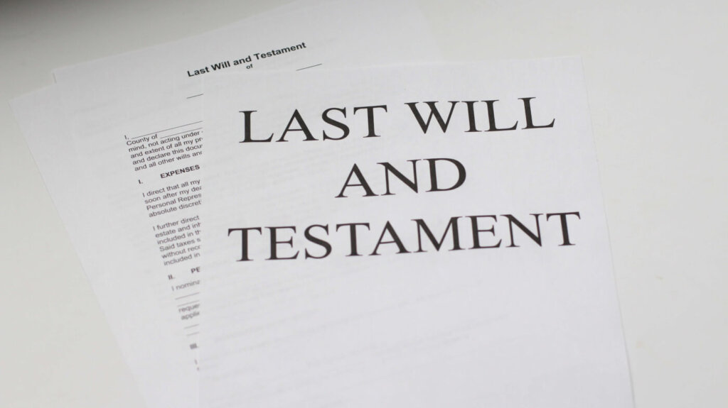 Paper reads "Last Will and Testament"