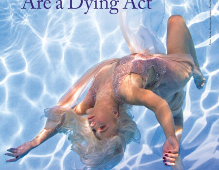 Sharna Burgess floats in water in a dancing costume with words that read: Dolphin Shows Are a Dying Act